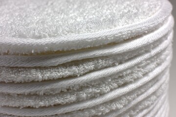 Poster - Soft white towels stacked neatly in a bathroom setting, perfect for guest use and daily routines near the sink
