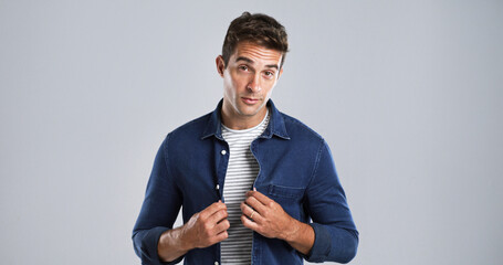 Poster - Man, confident and jean shirt for fashion with casual tshirt, trendy style and portrait on white background. Denim apparel, stripes and male model with stylish outfit, mockup space and cool clothes