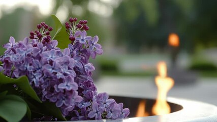 Poster - A close-up shot of a fire pit surrounded by various types of flowers