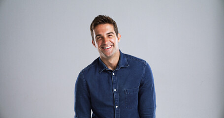 Poster - Portrait, happy man and laughing for fashion in studio with casual clothes or trendy style. Mockup space, comedy humor or male person with cool outfit, denim jacket and funny joke on white background