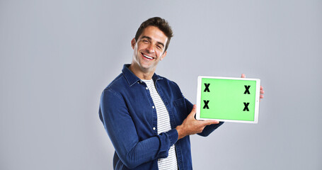 Leinwandbilder - Green screen, tablet and portrait of man in studio for research, networking or social media. Happy, digital technology and male person with communication, email or contact by white background.