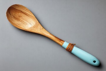 Aufkleber - Large wooden spoon with a turquoise handle and brown band used for cooking and serving food