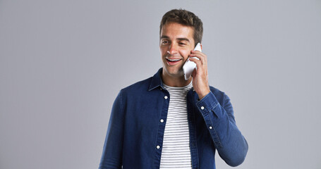 Poster - Studio, phone call and happy man talking for communication, news update or story. Mobile, conversation or journalist chat with contact for connection, listen or gossip with mockup space on background