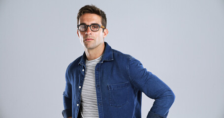 Fototapete - Glasses, serious and portrait of man in studio with confidence for IT career with vision. Spectacles, mockup space and face of male person from London with pride for tech job by white background.