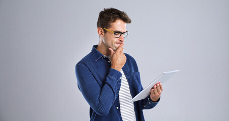 Leinwandbilder - Programmer, tablet or man with thinking in studio for software glitch, planning or troubleshooting. Mockup, web developer and confused with coding mistake, system solution or test on white background