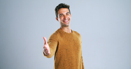 Poster - Happy man, portrait and studio with handshake for greeting or introduction on a white background. Male person, model or shaking hands with smile for meeting, thank you or agreement on mockup space