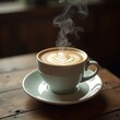 © ika - Steaming Latte Art Coffee Cup on Wooden Table