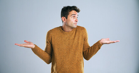 Aufkleber - Confused, shrugging and thinking with man in studio for doubt, problem solving or question. Search, solution and uncertain with unsure person on white background for answer, decision or mistake