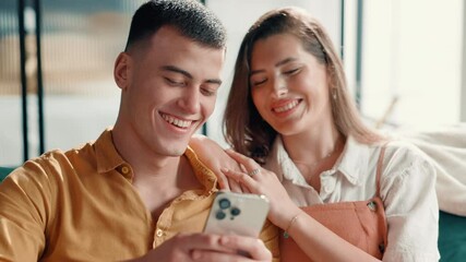 Poster - Phone, laugh and couple on sofa in home for social media scroll together for funny post. Relax, happy and man with woman reading goofy blog on mobile app with cellphone in living room at apartment.