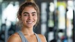 © yang - Smiling young woman in activewear exudes confidence and vitality.