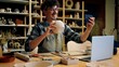 © Yuliia - Small business owner Caucasian man guy artist potter salesman blogger influencer mobile phone photo male sculptor craft sale online blog ceramics sell online social media handmade in pottery workshop