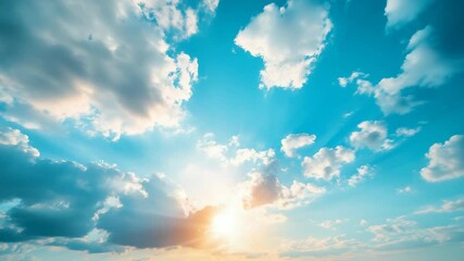 Poster - Sunlit clouds in a blue sky with sun rays, peaceful and vibrant atmosphere