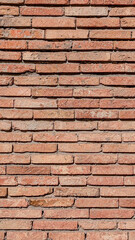 Poster - Weathered red brick wall surface displaying rich textural details, presenting aged architectural background with vintage rustic characteristics and nuanced color variations