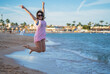 © StockBox - Woman jumping for joy on the Red Sea coast