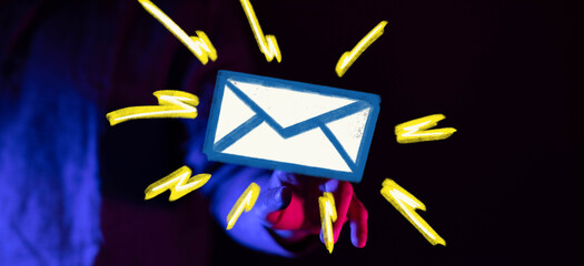 Leinwandbilder - Stock photo of a hand reaching for an email icon, signifying urgent communication.