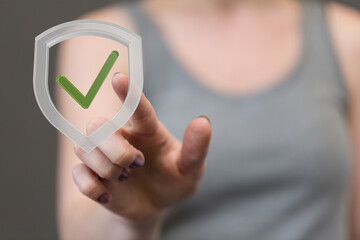 Aufkleber - Woman clicks a digital shield icon, representing security and data protection.