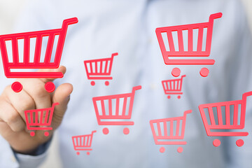 Aufkleber - Person interacts with digital shopping carts, symbolizing online shopping growth and e-commerce.