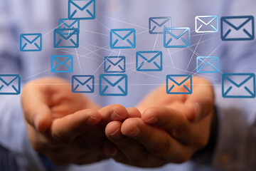 Leinwandbilder - Image of hands holding a network of email icons, representing global communication and connectivity.