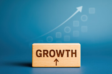 Poster - A wooden block engraved with growth stands prominently as an upward arrow and fading geometric shapes symbolize progress and development in business