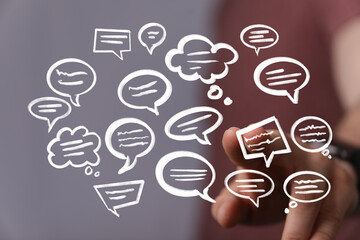 Aufkleber - Hand interacting with floating speech bubbles,concepts of communication, teamwork, and feedback.