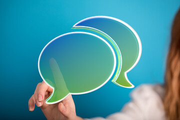 Aufkleber - Abstract image of a hand interacting with glowing speech bubbles, representing communication and digital interaction.