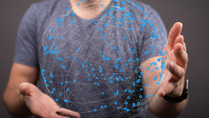 Aufkleber - A man holds a digital sphere representing global connections and networking.