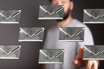 Aufkleber - Abstract image of a man interacting with floating email icons, representing communication and digital technology.