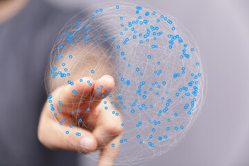 Fototapete - Abstract image of a hand interacting with a digital sphere, representing global networking and connectivity.
