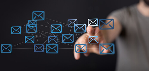 Poster - Hand interacts with a network of email icons, symbolizing global communication and digital connectivity.