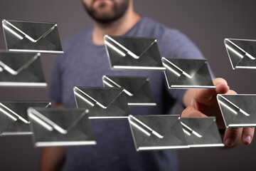 Poster - Stock photo of a man interacting with a digital interface showing multiple email icons.