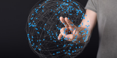 Leinwandbilder - Abstract image of a hand interacting with a digital globe, representing global network connection and data visualization.