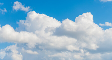 Wall Mural - Sky clouds background. Blue Heaven and white clouds. White cloudy Heaven with soft sun light. Clouds on pastel blue sky background. Sky Landscape Background. Sky Clouds Wallpaper.