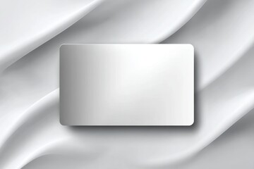 Wall Mural - Minimalist white background with curved fabric and a white card for text placement, providing a sleek and modern aesthetic for graphic design projects and presentations.