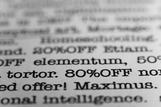 80 percent off. Text printed on a page. A piece of paper with a phrase. Marketing.