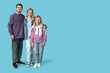 © Pixel-Shot - Happy family in stylish denim clothes on blue background