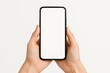 © Bijac - Female Hands Holding Up a Modern Smartphone with a Blank Screen Isolated on a Clean White Background