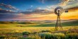 © udomsak - Classic windmill stands tall on a vast open range with rolling hills and wildflowers #windmill