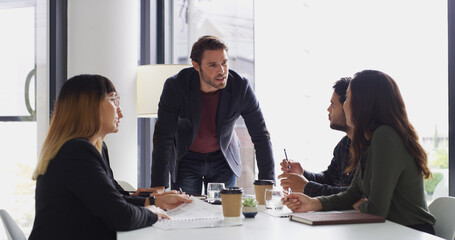 Poster - Business, man and meeting with team in office for discussion, planning and feedback for finance. Manager, people and brainstorming with ideas, investment proposal and collaboration for budget review