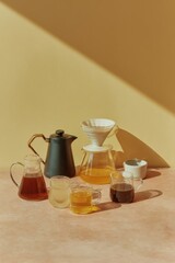Aufkleber - Modern Coffee Brewing Setup with Gooseneck Kettle and Glass Carafes in Warm Natural Light - Specialty Coffee Culture and Precision Craftsmanship