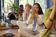 © Rido - Meditation group with mala and clasped hands