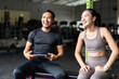 © itchaznong - Joyful Interaction Between Fitness Trainer and Client