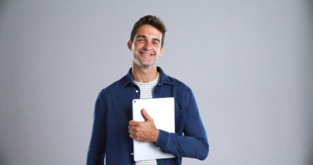 Leinwandbilder - Tablet, student and smile with portrait in studio for social media, internet and website app. Happy, man and isolated on white background with technology for digital application, e book or research