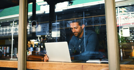 Poster - Coffee shop, laptop and man by window for typing report, proposal and research for remote work. Restaurant, website and person on computer for internet, online project and review for freelance career