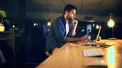 Leinwandbilder - Laptop, night and thinking with business man in office for deadline or feedback on creative report. Computer, problem solving and research with design employee at work for productivity in overtime