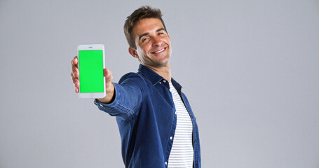 Aufkleber - Man, portrait and phone with green screen in studio for website, mockup space and white background. Student person, user or model with smile, smartphone and software app for university schedule
