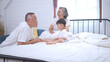 © Wosunan - Before putting the kids to bed, grandparents, and kid unwind and play