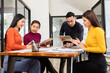 © SOMKID - Group of Asian business working analysis project brainstorm in modern office, Asian businesspeople team working together, Business startup and company strategy planning concept.