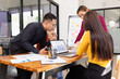 © SOMKID - Group of Asian business working analysis project brainstorm in modern office, Asian businesspeople team working together, Business startup and company strategy planning concept.