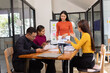 © SOMKID - Group of Asian business people working together and presentation a meeting in office,