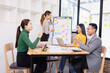© SOMKID - Group of business people working together with dashboard analysis and data management in conference room, Corporate business and dashboard to presentation concept.